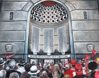 May include: A painting of a crowd of people in red and white clothing entering a building with a large archway. The building has a sign that reads "Troika Test Gates Pass the Greatest Fans in College Football".