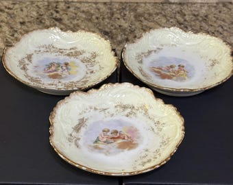 Limoges Cherub dishes LR over L set of 3