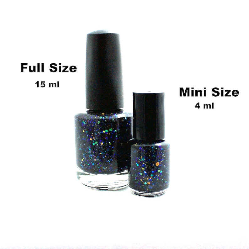May include: Two bottles of black nail polish with blue and gold glitter. The larger bottle is labeled "Full Size 15 ml" and the smaller bottle is labeled "Mini Size 4 ml".