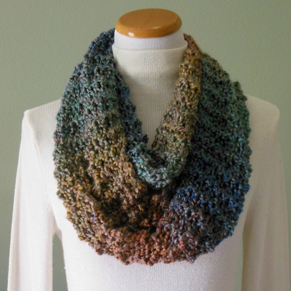 Hand Knit Infinity Fashion Scarf in varying shades of blue, teal, clay and ocher made with Lion Brand Painted Desert