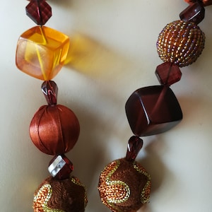 Necklace - large chunky cubic orange yellow and brown plastic beaded beads necklace