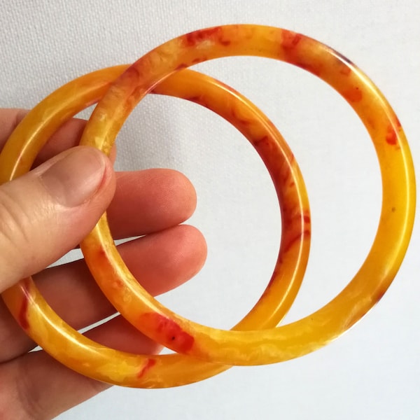 Bangles - pair of marbled yellow orange plastic bangles