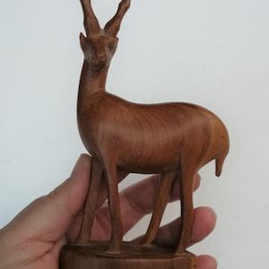 Single small carved African antelope or Gazelle figurine elongated vintage retro mid century solid wood