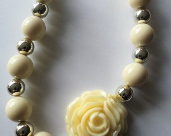 Necklace - cream and silver necklace with flower feature