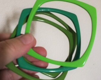 Set of green square plastic bangles