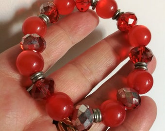 Bracelet  - pretty plastic beaded bracelet including moon glow orange red beads