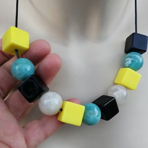 Necklace - yellow and black plastic cubes and marble blue and white plastic round beads necklace