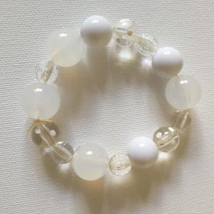 white  plastic beads elasticated bracelet very pretty