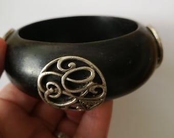 Simple dark wood wooden bangle retro design with silver celtic pattern embellishment