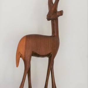 Single carved African antelope figurine elongated vintage retro mid century solid wood