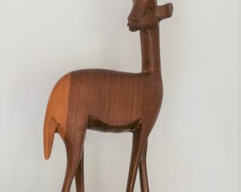 Single carved African antelope figurine elongated vintage retro mid century solid wood