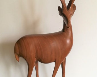 Single carved African antelope figurine elongated and tall vintage retro mid century solid wood