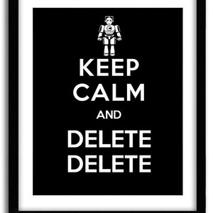 May include: Black framed print with white text and a robot illustration. The text reads "KEEP CALM AND DELETE DELETE". The robot is at the top of the print.