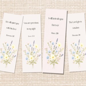 May include: Four rectangular paper bookmarks with a light pink background, each featuring a floral bouquet of yellow, blue, and lavender flowers at the bottom. The text reads: He will quiet you with his love Zephaniah 3:17, You are precious in my sight Isaiah 43:4, I will betroth you forever Hosea 2:19, and The Lord gives wisdom Proverbs 2:6.
