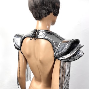 Fringed epaulettes, metallic embossed shoulder armor, futuristic armor, shoulder pads