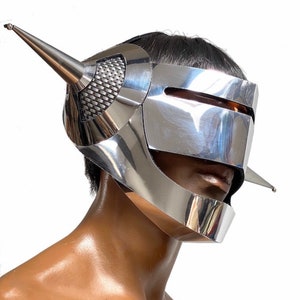 Where Giger met Sorayama, futuristic helmet ,cyborg headpiece robot cybergoth , robocop divamp couture