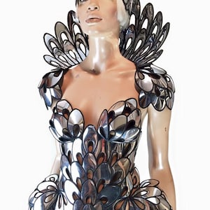 Chrome art nouveau inspired corset , burlesque performer futuristic gear