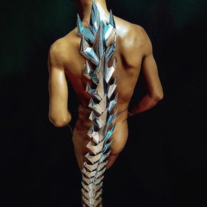 futuristic 5 feet chrome tail vertebra , column in silver chrome, stage costume, burning man, designer wear