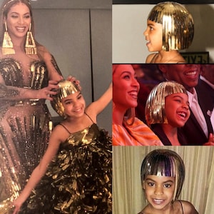 May include: A collage of four images featuring a young girl wearing a gold, fringed wig. The girl is smiling and laughing in each image. In one image, she is being helped to put on the wig by a woman with long, dark hair. In another image, she is sitting next to a man with short, dark hair. The images are all taken from different angles and show the girl from different perspectives.
