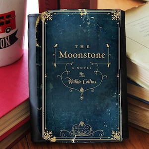 Cartera de mano de piel sintética plegable con tapa de libro Moonstone