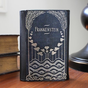 Cartera de mano plegable de piel sintética con diseño de libro de Frankenstein