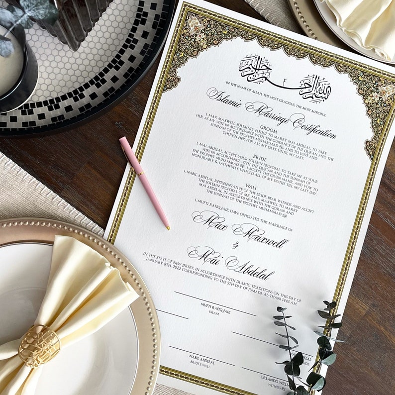 May include: A white Islamic marriage certificate with gold accents and ornate calligraphy. The certificate states "Islamic Marriage Certification" and includes the names "Max Maxwell" and "Mai Abdelal" as the groom and bride. The certificate is dated January 8th, 2022.