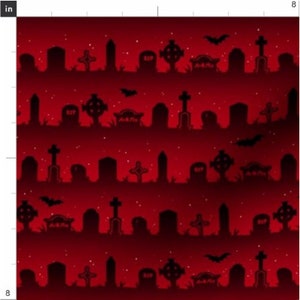 May include: A red and black Halloween themed fabric with a repeating pattern of a graveyard with tombstones, crosses, and bats. The background is a gradient of red and black.