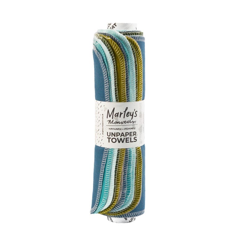 Peut inclure: Un rouleau d'essuie-tout en tissu bleu, vert et jaune de Marley's Monsters. L'&eacute;tiquette indique "Marley's Monsters Lavable + R&eacute;utilisable Unpaper Towels".