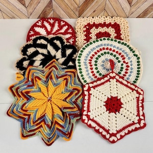 May include: A collection of colorful, handmade crochet hot pads in various shapes. The pads feature a starburst, round, and square designs with red, yellow, black, and white color schemes. These decorative items are perfect for kitchen use.