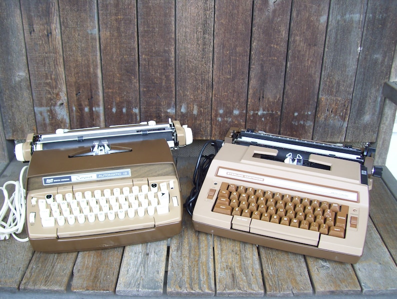 Smith Coronet Electric Typewriter Automatic 12 Wood Grain Or Smith Corona Sterling Cartridge Portable Typewriter Tan Brown Both Have Cases