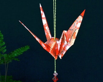 Origami Crane Hanging Ornament - red Japanese paper w/ flowers, peace crane, 1st yr anniversary, varnished, gold string, Swarovski crystals