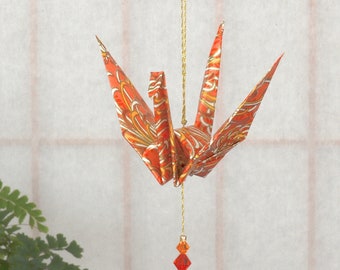 Origami Crane Hanging Ornament - orange Japanese paper w/ mums, peace crane, 1st yr anniversary, varnished, gold string, Swarovski crystals