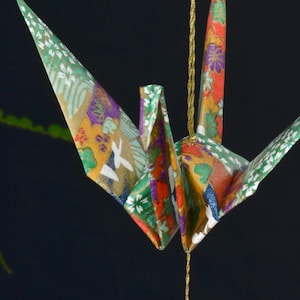 Origami Crane Hanging Ornament - green Japanese paper, 1st year anniversary, peace crane, varnished, gold string,  Swarovski crystals