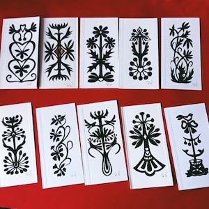 10 tarjetas populares recortadas a mano en papel. Recortes de papel originales.