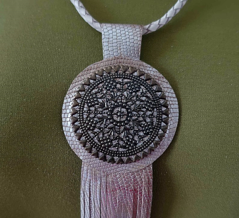 Gold leather fringe tassel pendant necklace.