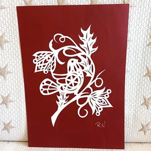 Hand Paper cut out art picture.