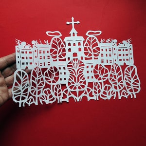 White paper cutting. Hand cut paper art picture. Paper cutting decor. Paper cut art work artist Rysarda
