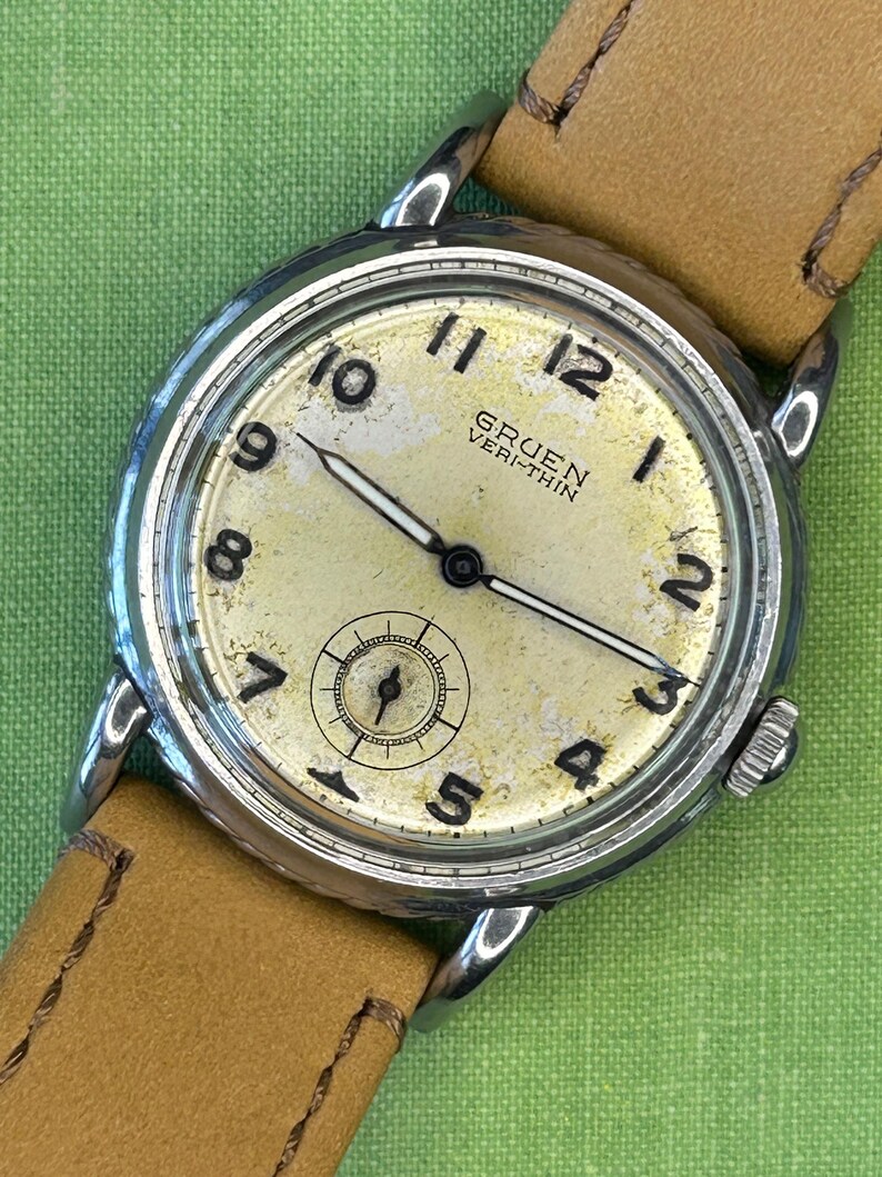 Vintage 1950s Gruen Veri-Thin Submarine Stainless Steel watch and small seconds patina dial. brown leather band.  Running, serviced, keeps time, working.