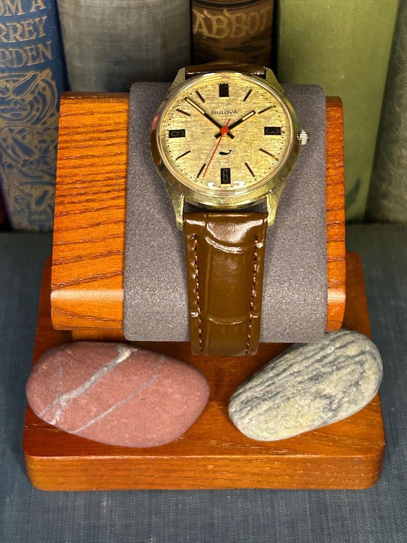 Vintage 1970 Bulova Sea King swiss watch with gold plated case and red sweep seconds dial. New brown leather band. Running, serviced, keeps time, working.