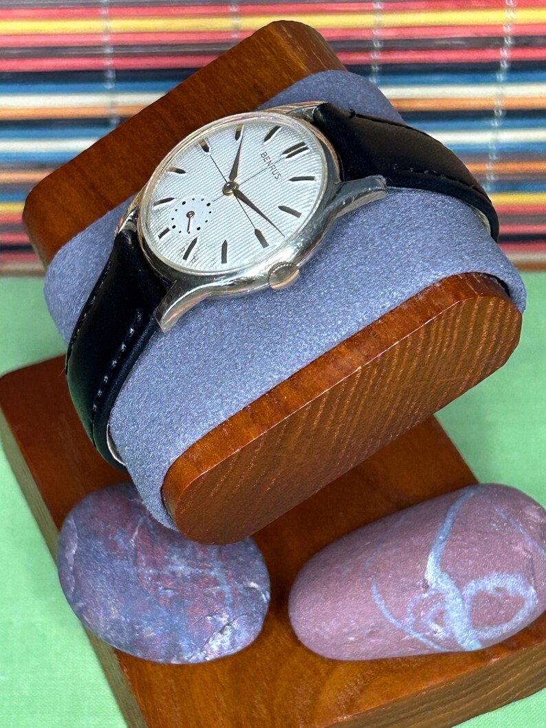 1950s Vintage Benrus crosshair watch with waffle dial and round gold plated case.  Gold crown. New black leather band. Running, serviced, keeps time, working