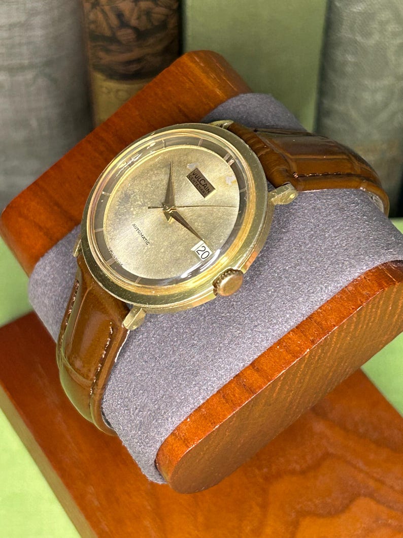 Vintage Vulcain Centenary automatic watch with gold plated case and brown leather strap.  Serviced and running.  Keeps time. working