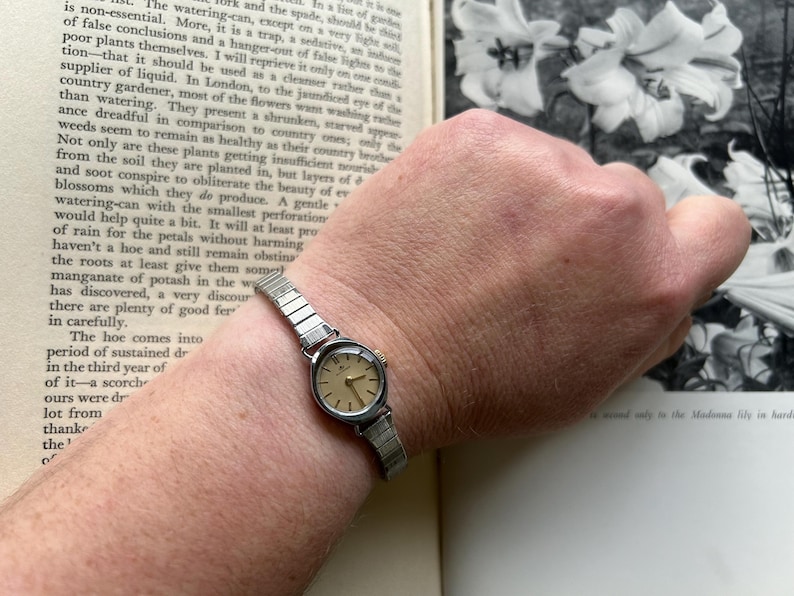 1970's Vintage Bucherer Ladies watch with Stainless Steel case and original bracelet.  Serviced and running.  Keeps time. works