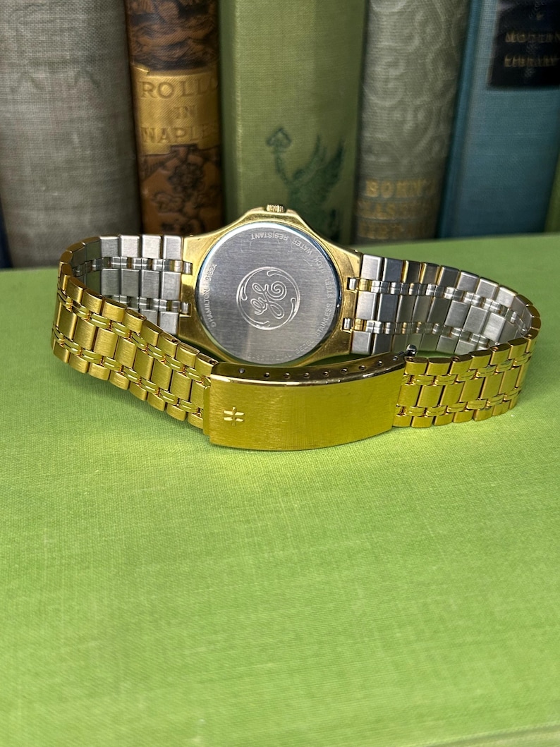 Hamilton Masterpiece Quartz watch model 9162a with gold plated case and original bracelet. Date window.  Running, keeping time, fresh battery.