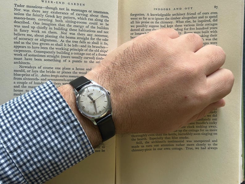Vintage Roamer Popular watch.  black leather band.  Running, serviced working, keeping time.    Silver color case.