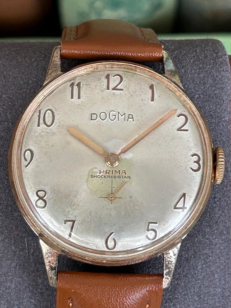 Vintage watch Dogma Prima jumbo swiss watch with rose gold plated case and small seconds dial.  New brown leather band. Running, serviced, keeps time, working.