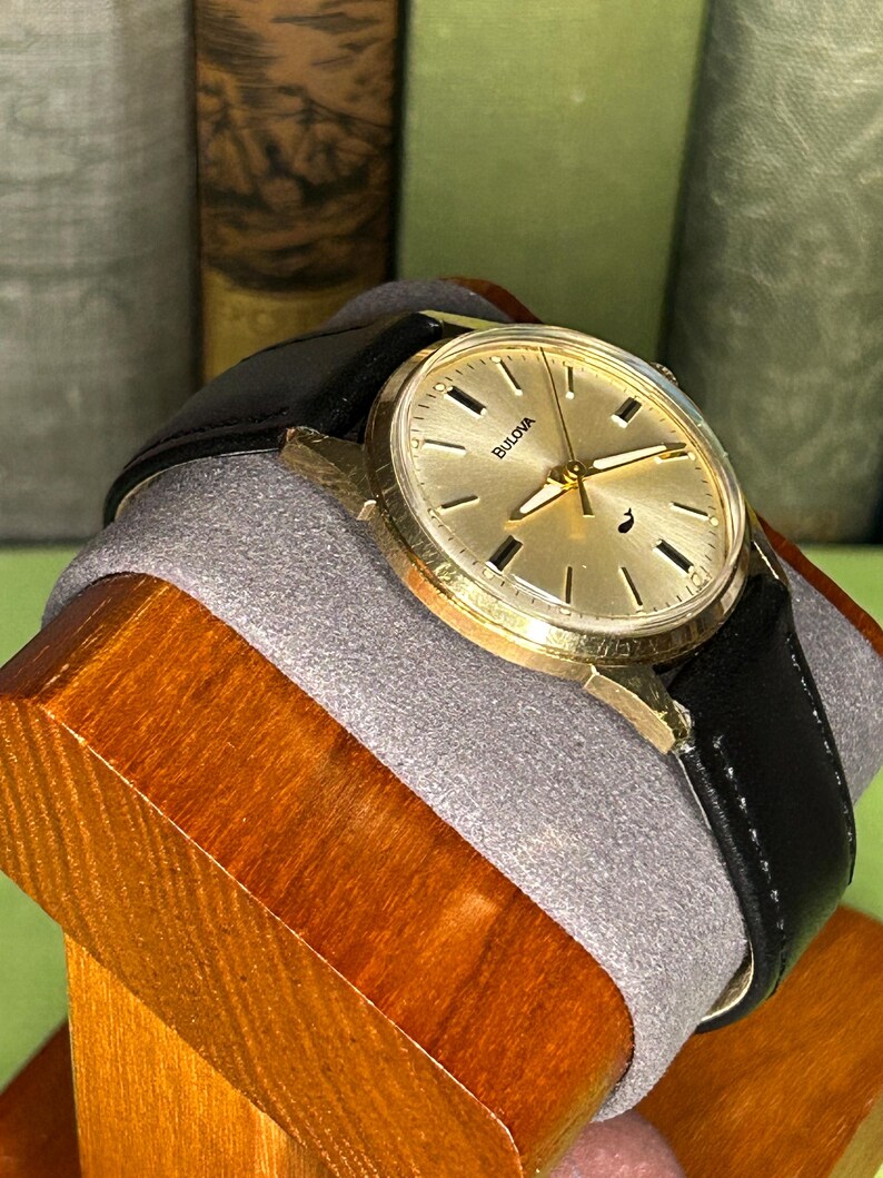 Vintage 1970 Bulova Sea King swiss watch with gold plated case and sweep seconds dial. New black leather band. Running, serviced, keeps time, working.