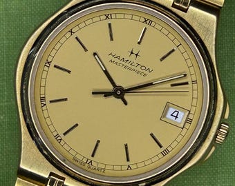 Vintage 1990s Hamilton Masterpiece Quartz watch. Keeps time and Running! original bracelet.