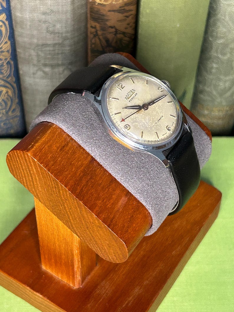 Vintage Roamer Popular watch.  black leather band.  Running, serviced working.    Silver color case.