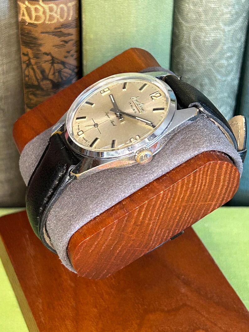 Vintage watch Omikron swiss watch with silver case and small seconds dial.  black leather band and silver crown. Running, serviced, keeps time, working.