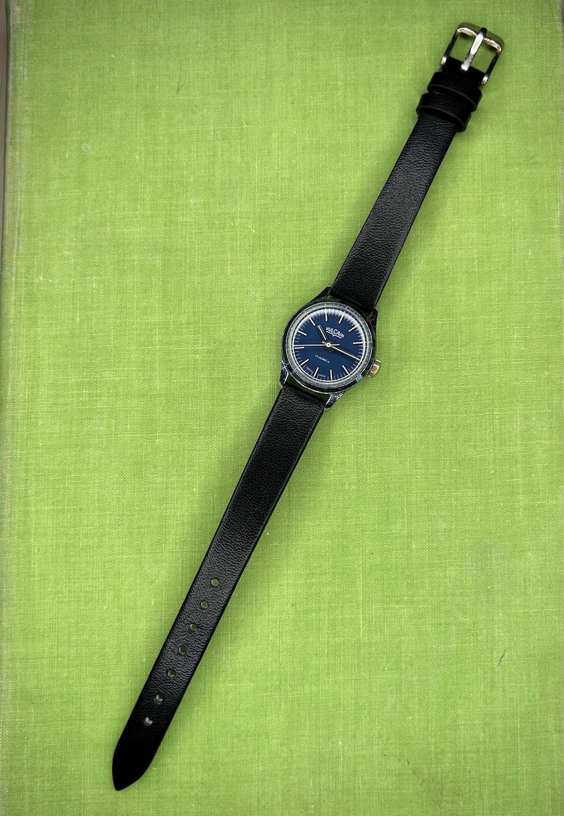 Vintage Vulcain Lady's watch with silver color case and black leather strap.  Serviced and running.  Keeps time. Working. Blue Dial